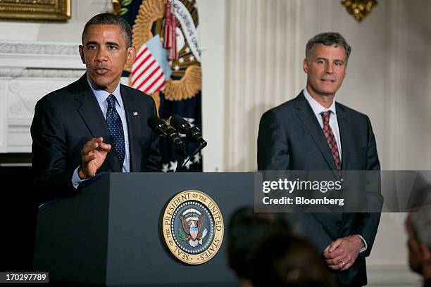 Alan Krueger, chairman of the Council of Economic Advisers , right, listens as U.S. President Barack Obama speaks during a nomination announcement in...