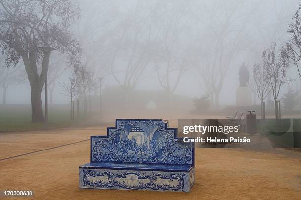 tiled garden bench rising from the fog - paixão stock pictures, royalty-free photos & images