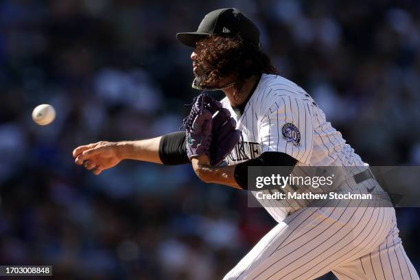 Pitcher Justin Lawrence the Colorado Rockies throws against the Los Angeles Dodgers in the eighth inning during Game One of a Doubleheader at Coors...