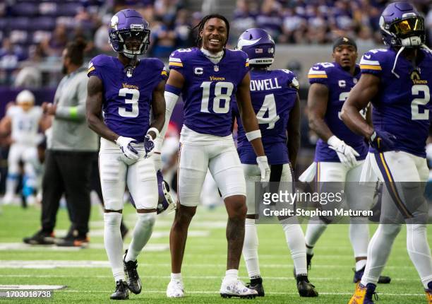 Justin Jefferson of the Minnesota Vikings warms up with teammates before the game against the Los Angeles Chargers at U.S. Bank Stadium on September...