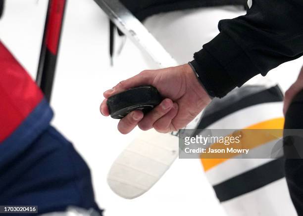 General view of a puck being held in the referee hand during the first period of the game between Pittsburgh Penguins and Columbus Blue Jackets at...