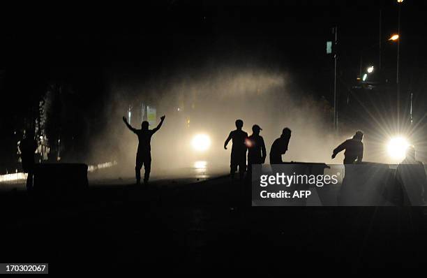 Turkish leftist protestors clash with riot policemen in the Gazi district of Istanbul on June 11, 2013.Turkish Prime Minister Recep Tayyip Erdogan...