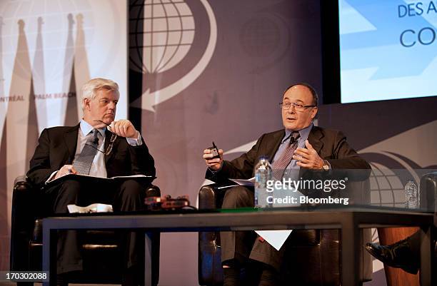 Luis Maria Linde, governor of the Bank of Spain, left, speaks while John Manley, president and chief executive officer of the Canadian Council of...