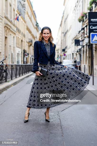 Influencer Alexandra Lapp, wearing a Maison Common short boucle jacket with ribbon details in navy, a Maison Common long sleeve blouse with plastron...