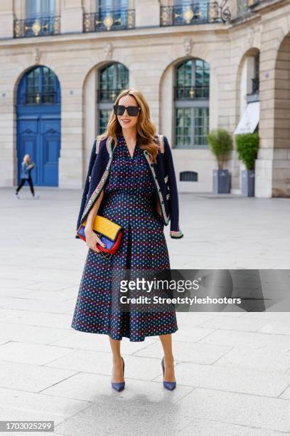 Influencer Alexandra Lapp, wearing a Maison Common tweed jacket with contrast trim in dark blue, a Maison Common easy silk shell dot print blouse in...