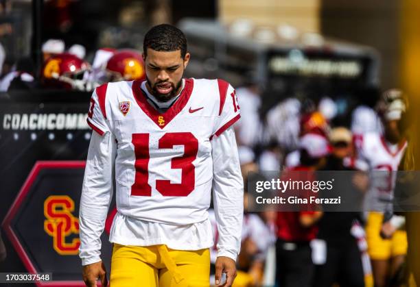 Trojans quarterback Caleb Williams walks in the team bench area during the game against Colorado at Folsom Field at the University of Colorado on...