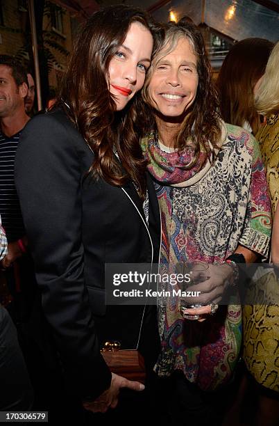 Liv Tyler and Steven Tyler attend the Stella McCartney Spring 2014 Collection Presentation at West 10th Street on June 10, 2013 in New York City.