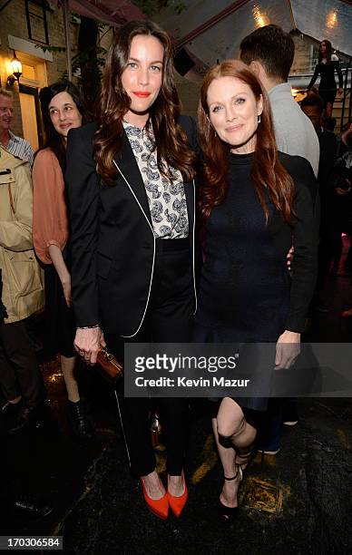Liv Tyler and Julianne Moore attend the Stella McCartney Spring 2014 Collection Presentation at West 10th Street on June 10, 2013 in New York City.