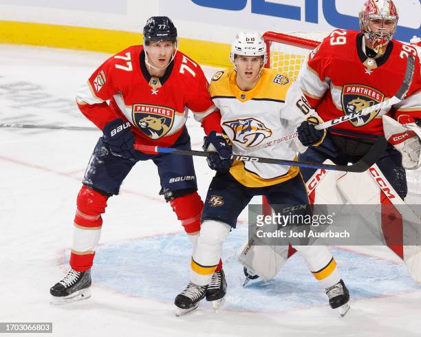Niko Mikkola of the Florida Panthers defends against Zachary L'Heureux of the Nashville Predators in front of the net uring a preseason game at the...