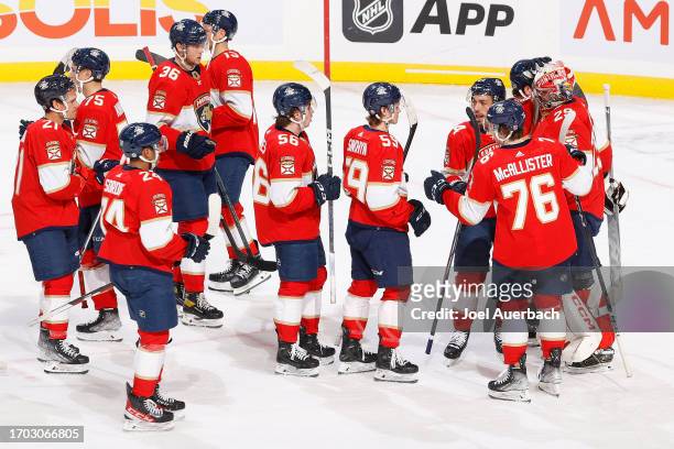 Teammates congratulate goaltender Mack Guzda of the Florida Panthers after the 5-2 win against the Nashville Predators during a preseason game at the...