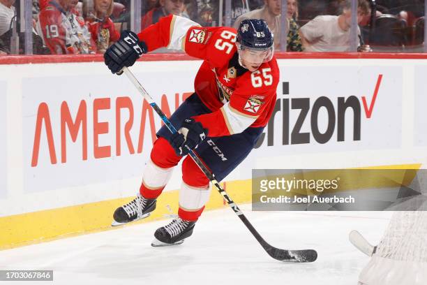 XLuke Coughlin of the Florida Panthers skates with the puck against the Nashville Predators during a preseason game at the Amerant Bank Arena on...