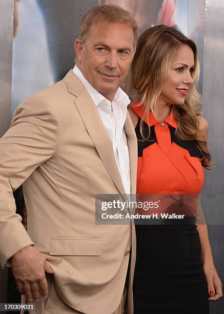 Actor Kevin Costner and Christine Baumgartner attend attends the "Man Of Steel" world premiere at Alice Tully Hall at Lincoln Center on June 10, 2013...