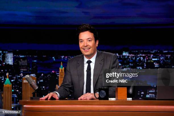 Episode 1844 -- Pictured: Host Jimmy Fallon arrives at his desk on Monday, October 2, 2023 --