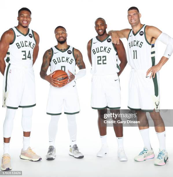 Giannis Antetokounmpo, Damian Lillard, Khris Middleton, and Brook Lopez of the Milwaukee Bucks pose for a portrait during 2023-24 NBA Media Day on...