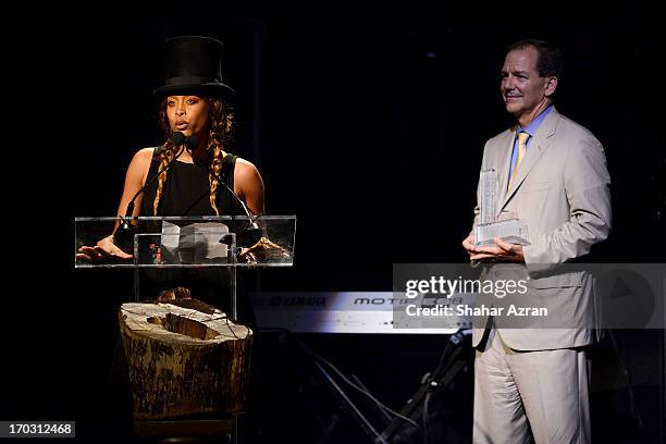 Erykah Badu and Paul Tudor Jones attend the 8th annual Apollo Theater Spring Gala Concert at The Apollo Theater on June 10, 2013 in New York City.
