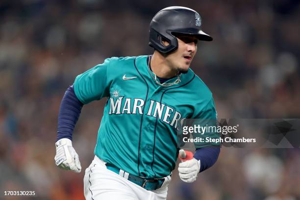 Josh Rojas of the Seattle Mariners singles against the Houston Astros at T-Mobile Park on September 25, 2023 in Seattle, Washington.