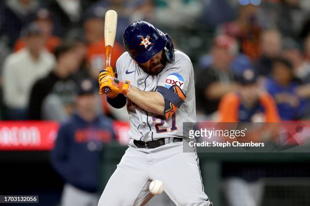 Jose Altuve of the Houston Astros is hit by a pitch against the Seattle Mariners at T-Mobile Park on September 25, 2023 in Seattle, Washington.