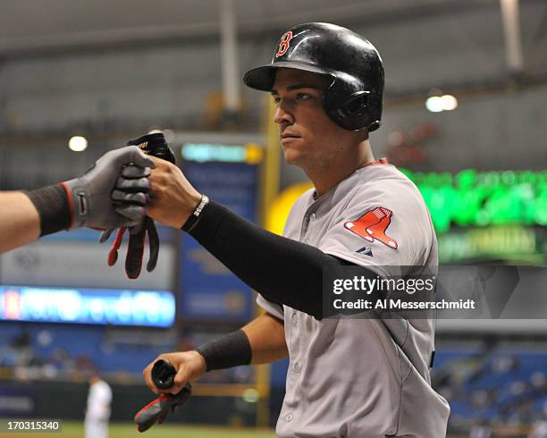 Infielder Jose Iglesias of the Boston Red Sox after scoring a run in the 14th inning against the Tampa Bay Rays June 10, 2013 at Tropicana Field in...