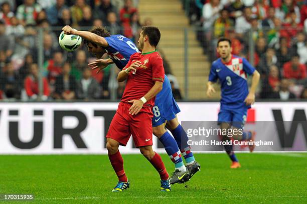 Joao Moutinho of Portugal fights for the ball with Ognjen Vukojevic of Croatia during the international friendly match between Portugal and Croatia...