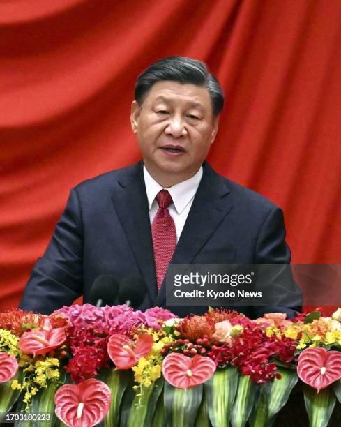 Chinese President Xi Jinping speaks at a reception in the Great Hall of the People in Beijing on Sept. 28 to celebrate National Day on Oct. 1 marking...