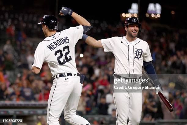 Parker Meadows of the Detroit Tigers celebrates his solo home run in the eighth inning with Matt Vierling while playing the Kansas City Royals at...