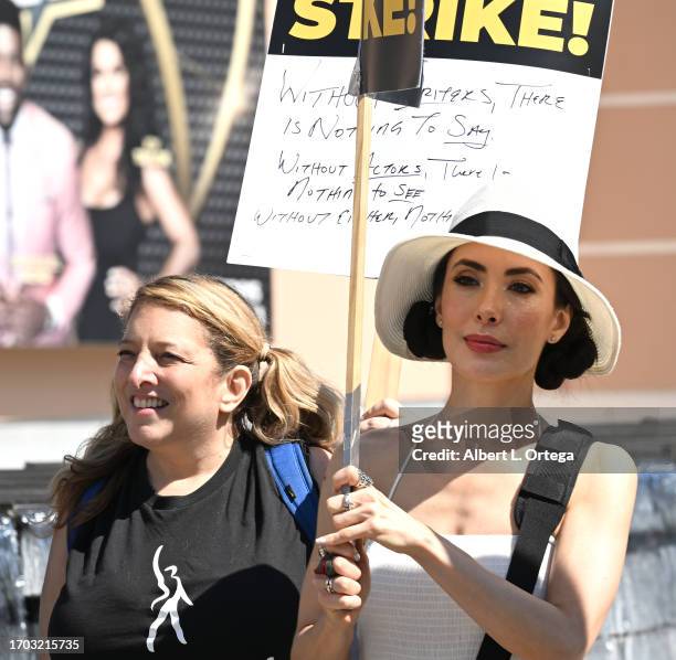 Taylor Loeb and Mandy Amano join striking members of SAG-AFTRA and WGA on the picket line in front of FOX Studios on September 26, 2023 in Los...