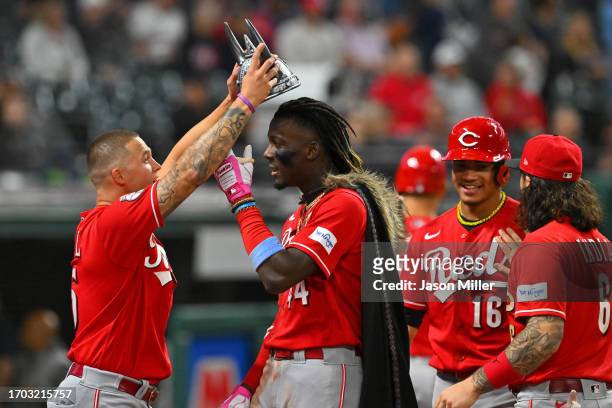 Nick Senzel crowns Elly De La Cruz of the Cincinnati Reds after De La Cruz hit a two-run home run during the ninth inning against the Cleveland...