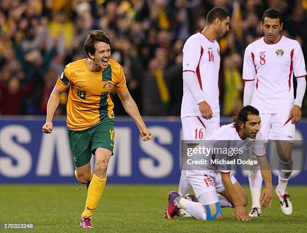 Robbie Kruse of the Socceroos celebrates a goal during the FIFA World Cup Qualifier match between the Australian Socceroos and Jordan at Etihad...