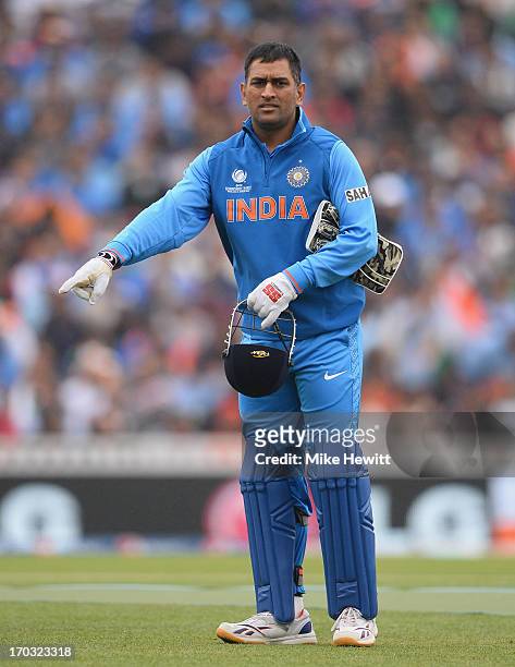 India captain Mahendra Singh Dhoni instructs his team during the ICC Champions Trophy Group B match between India and West Indies at The Kia Oval on...