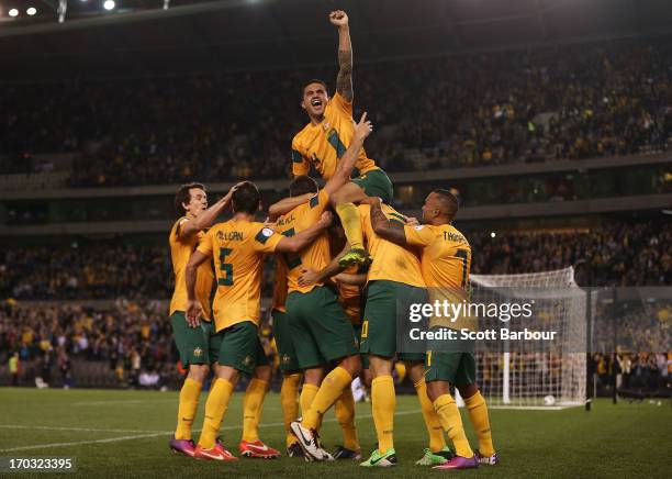 Tim Cahill and the Australians celebrate after Lucas Neill of the Socceroos scored a goal during the FIFA World Cup Qualifier match between the...