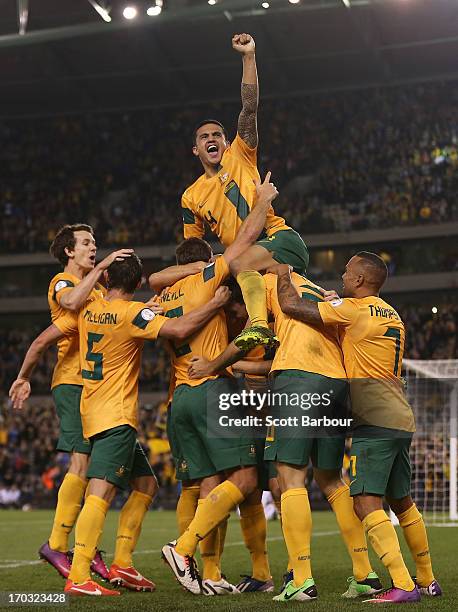 Tim Cahill and the Australians celebrate after Lucas Neill of the Socceroos scored a goal during the FIFA World Cup Qualifier match between the...