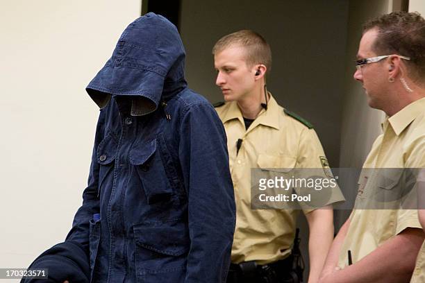 The defendant Carsten S. Hides his face under his hood prior to the trial during day eight of the NSU neo-Nazis murder trial at the Oberlandgericht...