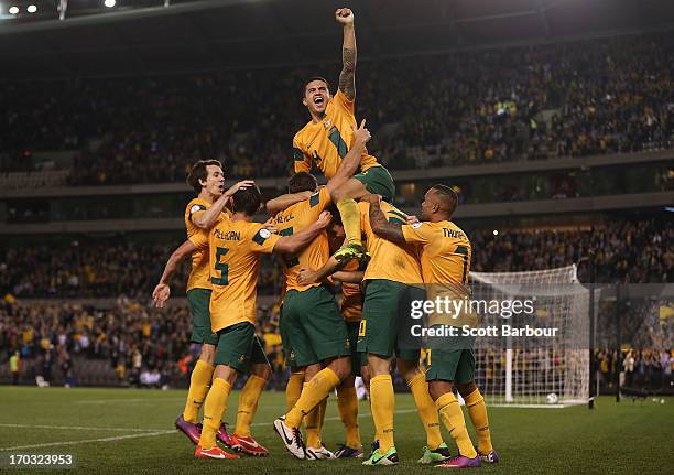 Tim Cahill and the Australians celebrate after Lucas Neill of the Socceroos scored a goal during the FIFA World Cup Qualifier match between the...