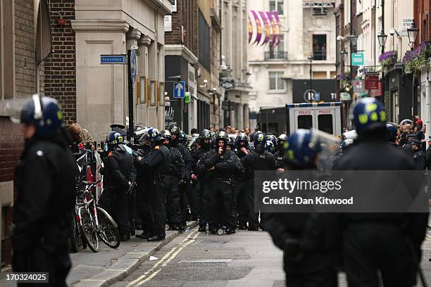 Police are seen on Beak Street to diffuse anti G8 protesters potentially becoming violent, as they reportedly occupy a Police Station ahead of next...