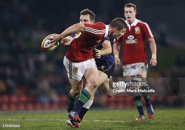 Brian O'Driscoll of the Lions attempts to catch the ball behind his back during the match between Combined Country and the British & Irish Lions at...