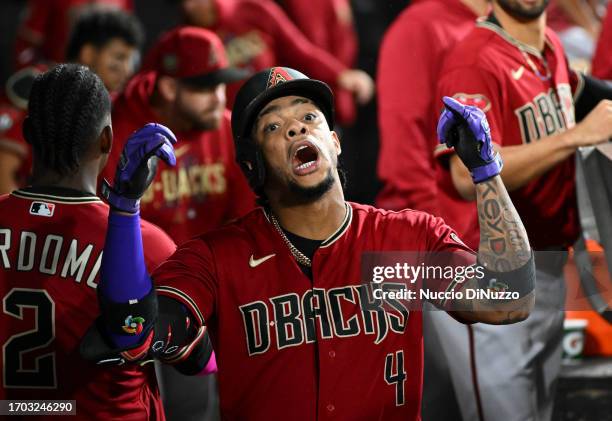 Ketel Marte of the Arizona Diamondbacks celebrates in the dugout after hitting a home run in the eighth inning against the Chicago White Sox at...