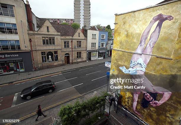 General view of Cosmo Sarson's mural of Jesus breakdancing that he has painted on the 8.5 metre wall beside The Canteen in Stokes Croft and is being...