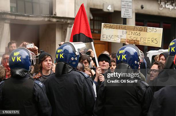 Protesters are seen on Golden Square surrounded by police after activists occupied a convergence centre of the Stop G8 protest group off Beak Street...