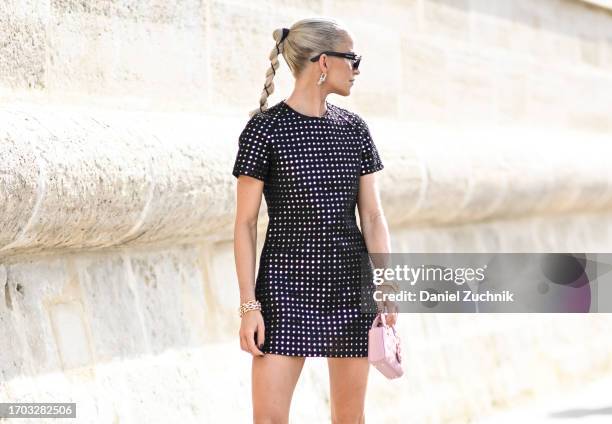Caroline Daur is seen wearing a Dior dress, black sunglasses and black shoes outside the Dior show during the Womenswear Spring/Summer 2024 as part...