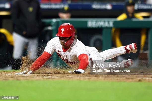Cristian Pache of the Philadelphia Phillies scores the winning run to defeath the Pittsburgh Pirates during the tenth inning at Citizens Bank Park on...
