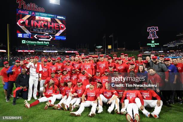 The Philadelphia Phillies pose for a team photo after defeating the Pittsburgh Pirates to clinch an NL Wild Card berth at Citizens Bank Park on...