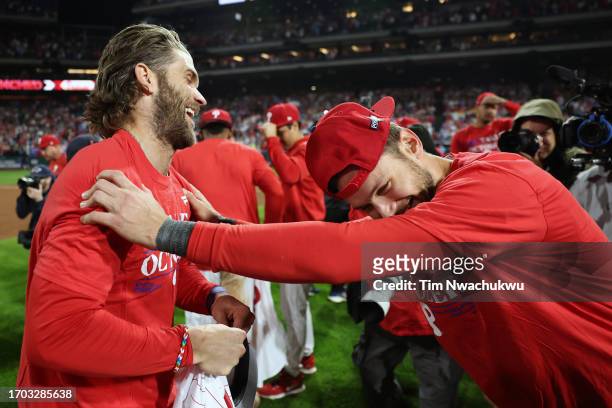 Bryce Harper and Trea Turner of the Philadelphia Phillies react after defeating the Pittsburgh Pirates at Citizens Bank Park on September 26, 2023 in...