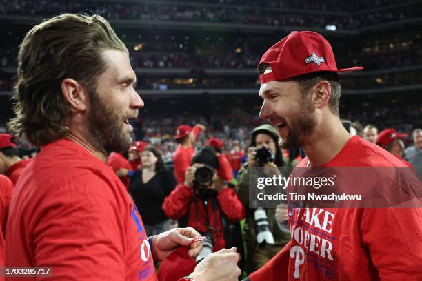 Bryce Harper and Trea Turner of the Philadelphia Phillies react after defeating the Pittsburgh Pirates at Citizens Bank Park on September 26, 2023 in...