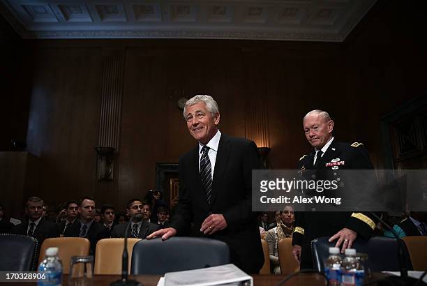 Secretary of Defense Chuck Hagel , and Chairman of the Joint Chiefs of Staff General Martin Dempsey , arrive at a hearing before the Defense...