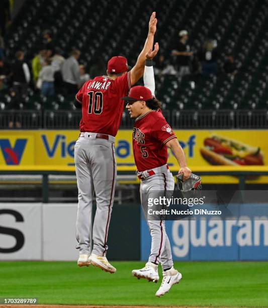 Jordan Lawlar and Alek Thomas of the Arizona Diamondbacks celebrate a 15-4 win over the Chicago White Sox at Guaranteed Rate Field on September 26,...