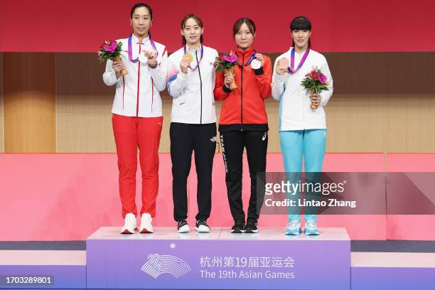 Silver medalist Shao Yaqi of China, gold medalist Yoon Ji-su of South Korea, bronze medalist Seri Ozaki of Japan and Zaynab Dayibekova of Uzbekistan...