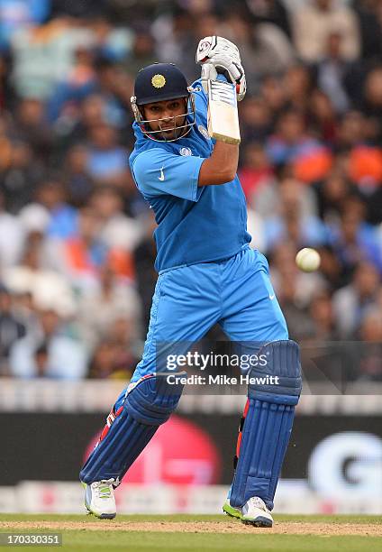 Rohit Sharma of India drives during the ICC Champions Trophy Group B match between India and West Indies at The Kia Oval on June 11, 2013 in London,...