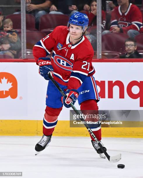 Kaiden Guhle of the Montreal Canadiens skates the puck during the first period against the New Jersey Devils at the Bell Centre on September 25, 2023...