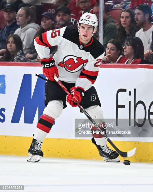 Nolan Foote of the New Jersey Devils skates the puck during the first period against the Montreal Canadiens at the Bell Centre on September 25, 2023...