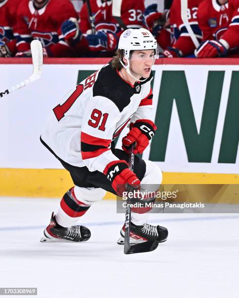 Dawson Mercer of the New Jersey Devils skates during the first period against the Montreal Canadiens at the Bell Centre on September 25, 2023 in...